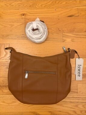 Brand New with Tags 
Iswee Tan Leather Purse with Strap